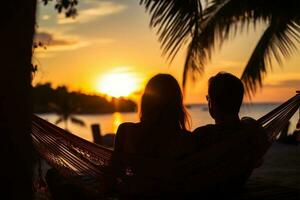 Silhouette of young couple relaxing in hammock on tropical beach at sunset AI Generated photo