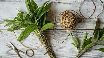 Sage bundle on wooden background, sage herb picked for medicinal and culinary use, overhead view photo