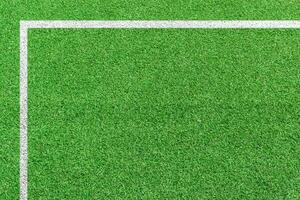 Grass soccer field with white pattern lines. Top view sport background. photo