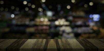 Empty wooden table top in front of abstract blur restaurant background. photo