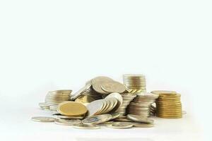 Coins stack and falling coin isolated on a white background. photo