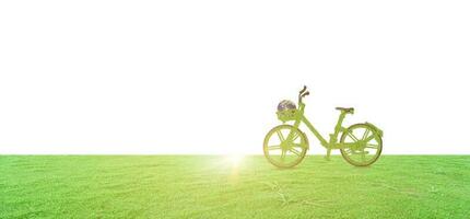 Green ecological bicycle and globe on green grass field isolated on white background. Environmentally friendly concept. image furnished by NASA photo