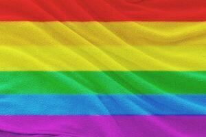 Fabric wavy flag of LGBT pride. Concept of the freedom love. photo