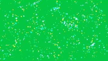 Colorful round dots moving particle animation overlay effect on green screen background video