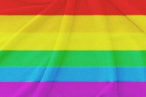 Fabric wavy flag of LGBT pride. Concept of the freedom love. photo