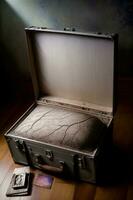 An Open Suitcase Sitting On Top Of A Wooden Floor. AI Generated photo