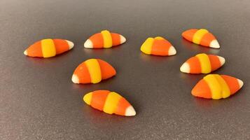 A Group Of Candy Candies Sitting On Top Of A Table. photo