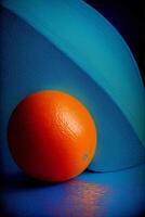 An Orange Sitting On Top Of A Blue Table. AI Generated photo