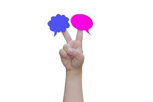 Two speech bubbles on child hand fingers isolated on white background, with clipping path. photo