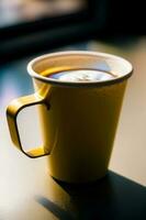 A Yellow Coffee Cup Sitting On Top Of A Table. AI Generated photo