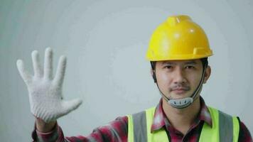 Asian fornman forbid and reject hardhat showing gesture to accept money white background. Architect, Engineer of Concept. video