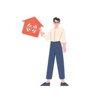 The man is depicted in full growth, holding the icon of the house in his hands. IoT concept. Vector illustration in flat style.