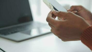 Businesswoman hands holding cradit card and using credit card online shopping. Online shopping concept video