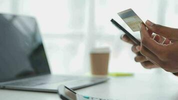 Businesswoman hands holding cradit card and using credit card online shopping. Online shopping concept video