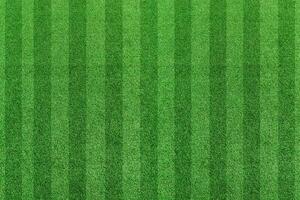 Top view stripe grass soccer field. Green lawn pattern background photo