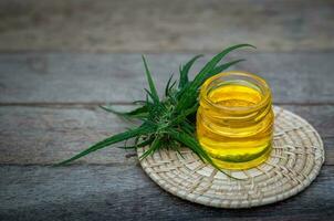Bowl with hemp oil,  Cannabis oil, CBD oil hemp products, medical marijuana,  cannabinoids and health. photo