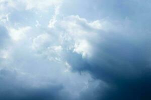 Sunbeam through the cloud on blue sky photo