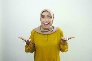 A portrait of a shocked Asian woman wearing a mustard casual dress, isolated by a white background photo