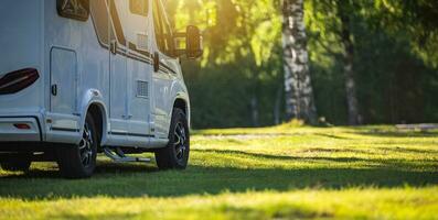 Semi Integral Camper Van on a Sunny Campground RV Park photo