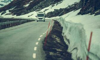 White RV Driving Down the Road photo