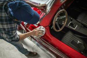 Classic Cars Passionate Cleaning His Retro Muscle Car photo