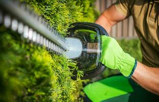 Powerful Cordless Electric Hedge Trimmer Close Up. photo