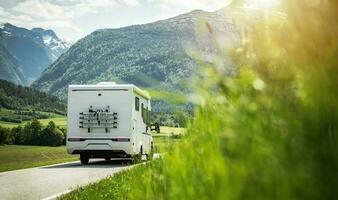 White RV on a Road During Sunny Summer Day photo