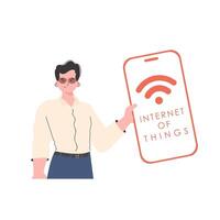 The guy is holding a phone with the IoT logo in his hands. Internet of things and automation concept. Vector illustration in trendy flat style.