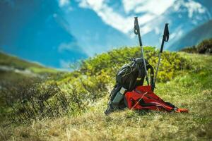 Hikers Backpack on a Sunny Mountain Trail photo