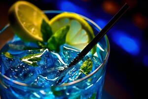 Blue cocktail with lime, mint and ice. photo