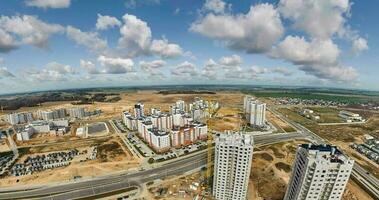 abstract circular curvature of surface of earth and twisting of sky into blue sphere inside urban infrastructure video