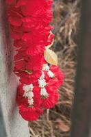 red plastic flower garland hanging photo