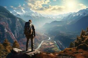 Young hiker with backpack in mountains photo