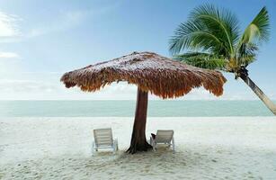 selective focus beach chairs with umbrella wood and beautiful sand beach with coconut tree photo