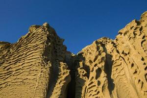 Vlychada beach volcanic ash sand rock formation on Santorini island in Greece photo