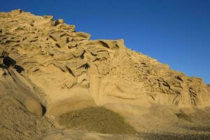 Vlychada beach volcanic ash sand rock formation on Santorini island in Greece photo