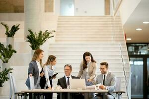 Young startup team working in the office photo