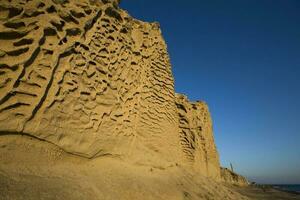 Vlychada beach volcanic ash sand rock formation on Santorini island in Greece photo