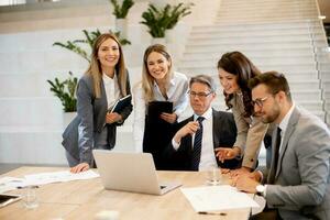 Young startup team working in the office photo