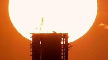 Sunrise Behind the City Buildings and Construction With Mega Telephoto Zoom Under Heat Radiation video