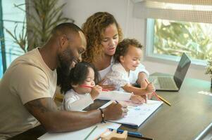 Happy African American parent playing and drawing with daughters in home photo