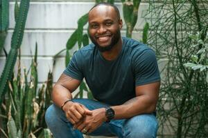 Happy African American man smiling in backyard at home photo