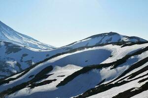 snow volcanoes in Kamchatka, snowy mountains photo