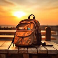 Backpack with books on wooden table over sunset sky background. Back to school concept. Generative AI photo