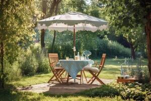 Cafe table with chair and parasol umbrella in the garden. photo