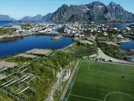 Aerial view of fishing village and football field on Lofoten Islands in Norway photo