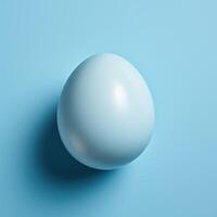 Single Easter blue colored egg on blue background. Generative AI photo