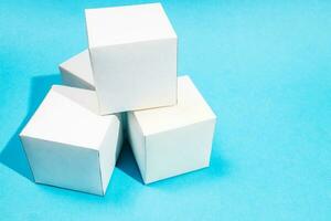 above view of several hand-crafted cubes on blue photo