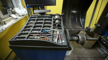 Car mechanic tool kit for wheel balancing and repair. photo