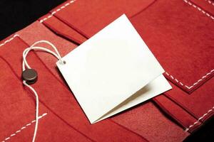 Part of a red leather wallet or purse close-up. photo